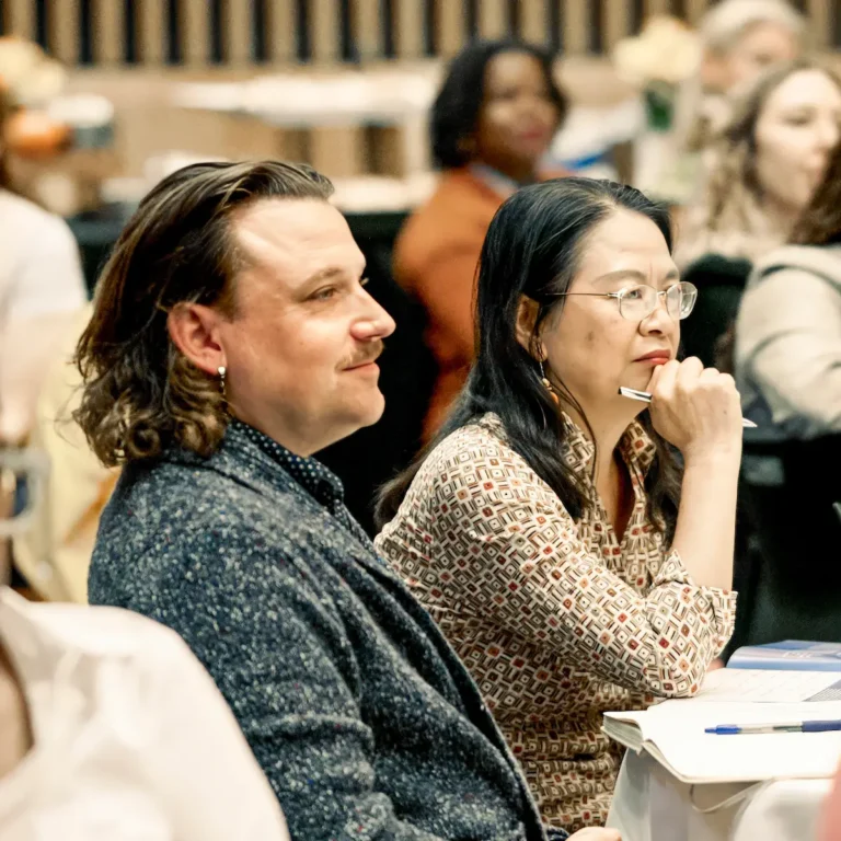 Man and woman listening intently at Life After High School 2024