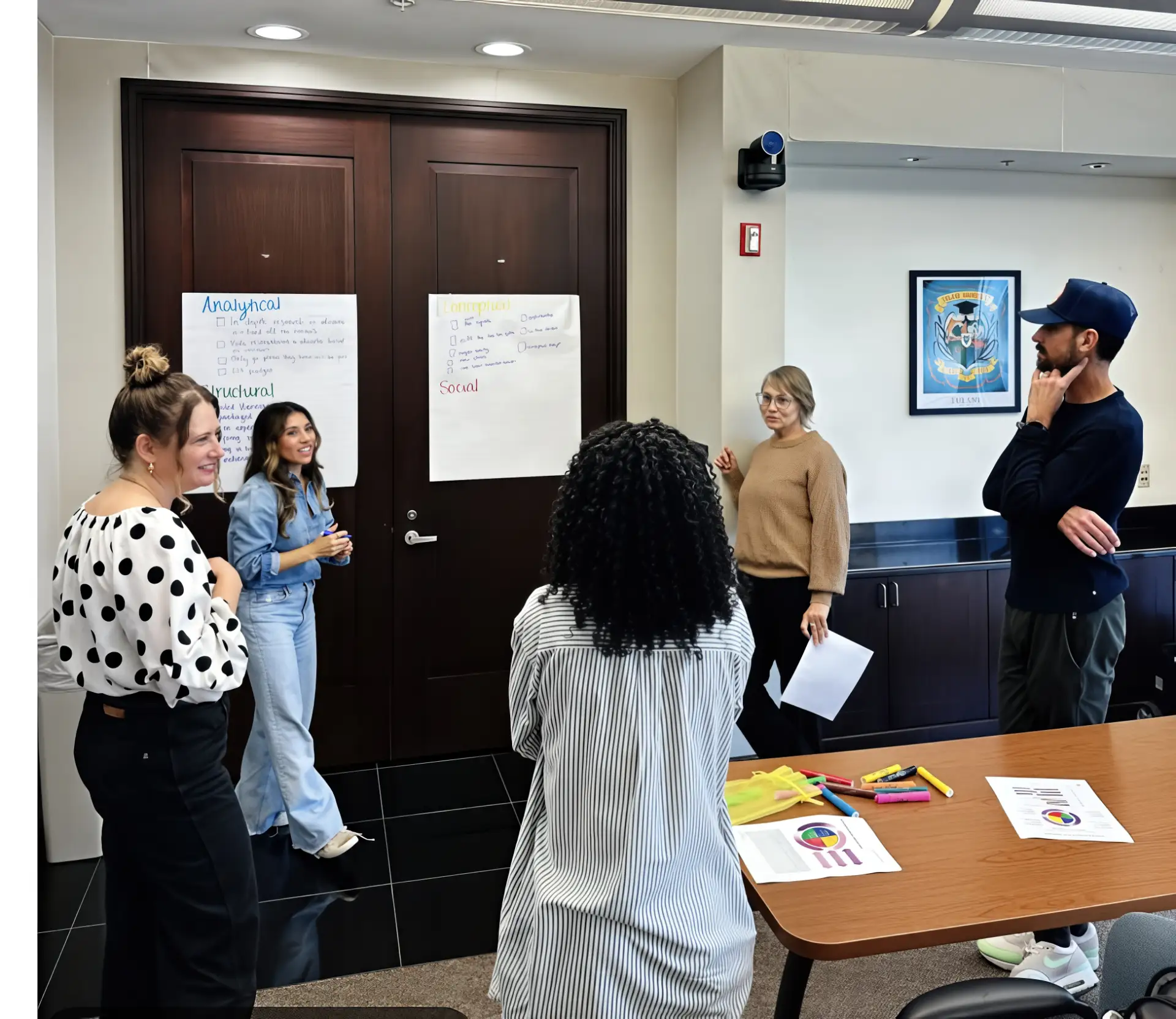 Cowen Institute team members discussing organization goals